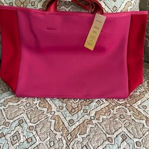 Somersault neoprene tote. Hot pink and red accents. New with tags.